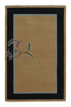 a rug with an image of a plant in the center and black border around it