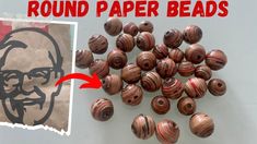 there are many round paper beads next to a photo with an old man's face on it