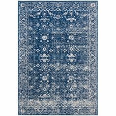 a blue and white rug with an ornate design