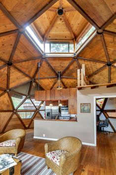 a living room with wooden walls and ceiling