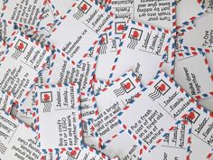 many red, white and blue mail envelopes are scattered on top of each other