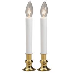 two white candles with gold accents on each candle holder, one is lit and the other is turned off