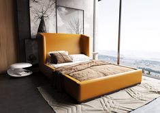 a bed sitting on top of a wooden floor next to a tall window with lots of windows