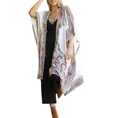 Raj Aamani Thick Stitch Embroidered Duster Kimono Aamani Thick Stitch Embroidered Duster Kimono elegantly elevates your style. The relaxed body is comfortable for all body types. Style this contemporary and versatile kimono with your favorite denims, dresses and shorts with heels or boots.       Only Open Front, Print- Paisley      Colors- White with Gold, White w Blue, White with Black     One Size fits most (2-16)      Material: 100% Rayon      Care: Dry Clean      Imported Fitted Bohemian Kaftan With Kimono Sleeves, Spring Kaftan With Kimono Sleeves And Fitted Design, Spring Fitted Kaftan With Kimono Sleeves, Fitted Long Bohemian Kimono, Patterned Kaftan For Spring, Long Kimono With Paisley Print For Beach, White Long Kimono For Fall, Long White Kimono For Fall, Elegant White Kimono For Festival