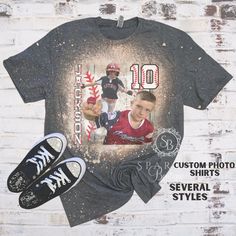 a t - shirt with the image of two baseball players on it and an old pair of sneakers