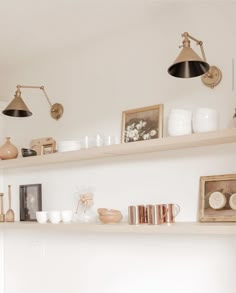 the shelves are filled with vases, bowls and other items on them in this room