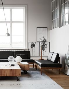 a black and white living room with modern furniture