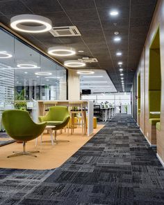 an office with chairs and tables in it