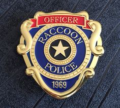 Raccoon City R.P.D. Metal Costume/Cosplay Badge available with Pin fixture (66mm x 63mm) Material: Zinc Alloy Colour: Gold, Blue and Red Fixtures: Pin Dimensions: 66mm x 63mm Weight: 62 grams Please read the shipping options below and select the required option at checkout. ----Shipping Information---- All of our products are shipped from the United Kingdom. All the items we sell are in stock items and will ship same day or next day depending on the time the item was purchased. Please note all d Resident Evil Raccoon City, Metal Costume, Metal Props, Red Banner, Umbrella Corporation, Blue Banner, Tactical Vest, R P, Star Logo