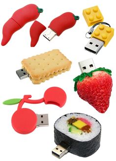 several different types of usb devices are arranged in the shape of sushi, strawberry, banana, and other food items