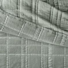 the texture of an unmade bed is shown in this black and white photo,