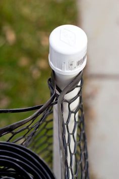 a close up view of the back end of a tennis racquet with wires attached to it