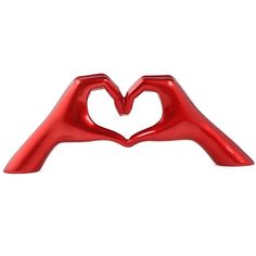 two red plastic hands making a heart shape with their fingers on top of each other