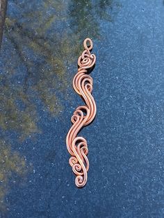 Inspired by nature's magic, trees, rocks, ocean waves, rippling waters and rivers. Each pendant is a custom one of kind piece, I personally make to order. See other matching wave rings and bracelets here: https://wizardswireworks.etsy.com Made with 100% pure copper wire. Pendant is 3" inches long and 1" inch wide. Contact me if you have questions, regarding shipping, materials, design or any other. Thanks so much Billy. Copper Wire Art Long, Copper Wire And Wood Art, Electrical Copper Wire Art, Copper Wire Art Ideas, Magical Woods, Wave Rings, Copper Wire Crafts, Copper Wire Art, Wire Wrapped Jewelry Diy