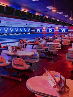 the bowling alley is full of chairs and tables