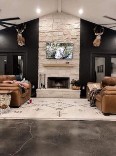 a living room filled with furniture and a fire place