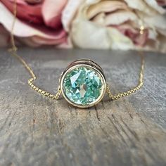 Paraiba Tourmaline Bezel Pendant Round Green Necklace - Etsy Cabachon Bezel Necklace, Yellow Gold Round Green Amethyst Jewelry, Gold Birthstone Necklace, Pendant Delicate, Pink Sapphire Pendant, Faberge Jewelry, Sapphire Necklace Pendants, The Crown Jewels, Floating Necklace