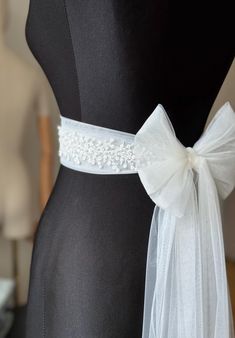 A stunning, elegant statement wedding sash is exquisitely beaded in beautiful vintage pattern. Your choice tulle  sash is attached to the beading and ties at the back into a bow.  An ultimate luxurious accent piece for your wedding dress or for any special occasion dresses. Accentuate your waist and add a touch of feminine charm to any dress with this tulle sash. Even the most simple gown can transform into a dreamy ensemble with this voluminous bow. Color embroidery - ivory or white Color tulle may be different  - white, ivory... and other Bead embroidery length 50 cm The belt is made as a long ribbon that you can tie around your waist. Belt For Gown Dress, Wedding Bridal Accessories, Satin Ribbon Belt, Belted Wedding Dress, Wedding Dress Belts And Sashes, Belts For Dresses, Beaded Bridal Sash, Simple Gown, Wedding Dress Sash Belt