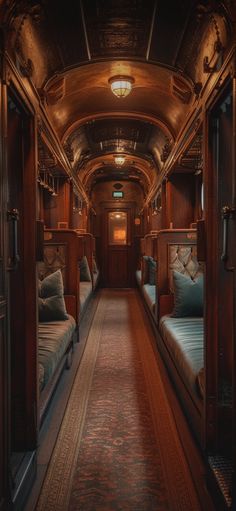 the inside of a train car with several couches and pillows on each side of it