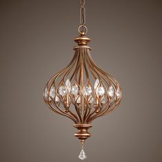 a chandelier with crystal drops hanging from the ceiling