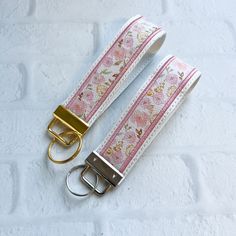 Cherry Blossom Vegan Leather Wristlet Keychain Key chain, Bridesmaid Gift Idea Gifts Under 20 For Her, Wristlet key fob, lanyard fob You are purchasing ONE wristlet keychain as shown in the photos above.  Designed with a combination of vegan leathers, this wristlet features an appliquéd center that can be monogrammed or personalized for an additional fee.   This wristlet is 5x1.25" not counting the hardware.   Due to the nature of the different vinyls, pattern placement will vary.  No two are ex Wrist Lanyard Aesthetic, Car Key Keychain, Wristlet Keychain Ideas, Aesthetic Keys, Key Chains Aesthetic, Car Keys Keychain Ideas, Car Keychain Ideas, Leather Wristlet Keychain, Cute Keychains