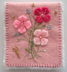 pink felt with flowers and gold accents on it