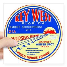 the key west florida sticker is shown in blue and orange, with an image of a