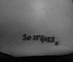 a tattoo saying so it goes on the back of a woman's stomach