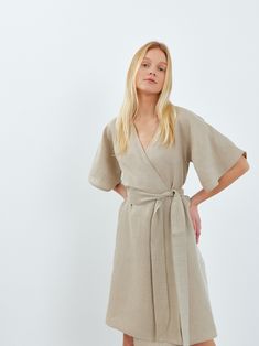 "MARY is a short sleeve midi linen wrap dress. DETAILS - Wrap robe - Self tie belt - Dolman style sleeves - Knee length - 100% lightweight European linen fabric - Cut and sewn to order just for you in our studio COLOR - Undyed, you can also choose other colors above - Fabric samples are available here https://www.etsy.com/listing/586569696/linen-fabric-samples SIZING & FIT - Relaxed fit - True to size - Measurements taken from a size S - Model is 5'8\" / 173cm and wearing a size S CARE FOR LINEN - Machine wash up to 30ºC/86ºF gentle cycle - Lay flat to dry or tumble dry low - Warm iron if needed - Do not bleach SIZE GUIDE Size conversion guide Size XS (US 0-2, IT 36-38, UK 4-6, Japan 3-5, France 32-34) Size S (US 4-6, IT 40-42, UK 8-10, Japan 7-9, France 36-38) Size M (US 8-10, IT 44-46, U Wrap Dress Linen, Wrap Dress Summer, Wrap Dress Outfit, Summer Wrap Dress, Kimono Sleeve Dress, Wrap Dress Styles, Linen Wrap Dress, Kimono Wrap Dress, Dress Kimono