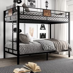 a black bunk bed sitting in a bedroom next to a book on top of a rug