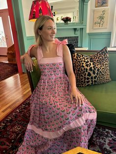 This is it! THE dress of the summer! Meet Maisie, our newest cotton block print maxi dress in a Pink Posey print. She’s full of sweet details like a tiered skirt, and contrasting striped banding. The bow straps are adjustable for the perfect fit, and it features a smocked back panel for comfort. Did we mention it has POCKETS!? Whether you're sipping lemonade on the porch or hitting up a summer wedding or soirée, this dress is a fun, versatile addition to your closet. Throw it on with sneakers or Designer Block Print Maxi Dress, Multicolor Block Print Maxi Dress, Beach Multicolor Block Print Dress, Multicolor Block Print Beach Dress, Bohemian Floor-length Block Print Dress, Bow Straps, Block Print Dress, Printed Maxi, Tiered Skirt