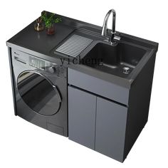 a kitchen sink with a washer and dryer in it's side cabinet