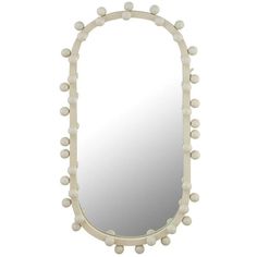 a white mirror with some balls on it