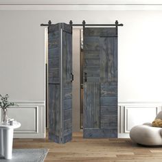 an open wooden door in a white room