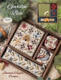 an image of a cross stitch book with the title garden box written in english on it