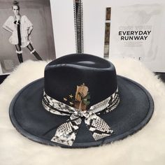 Elevate Your Style Game With This Stunning Black Distressed Fedora. Crafted With Snakeskin Detailing, This Hat Adds A Touch Of Edgy Glamour To Any Outfit. The Size L/Xl Fits Most Women Comfortably, Making It A Versatile Addition To Your Wardrobe. Perfect For Any Occasion, This Fedora Is A Must-Have For Any Fashion-Forward Woman. The Black Color Adds A Classic Touch, While The Unique Style Makes It A Statement Piece. Pair It With Your Favorite Outfit And Accessories To Create A Standout Look. Chic Black Fedora With Curved Brim, Luxury Black Elegant Fedora, Western Style Black Fedora For Western-themed Events, Chic Black Brimmed Fedora, Fedora Hat Outfit, Outfits With Fedora Hats, Outfit With Fedora, Black Fedora Hat For Western-themed Events, Fall Hats For Women