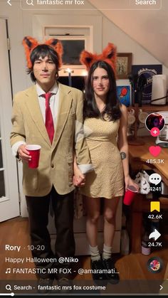 a man and woman dressed up for halloween