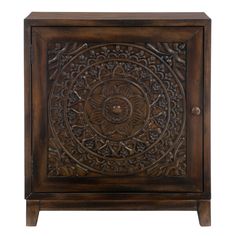 an ornate wooden cabinet with carvings on the front and side panels, in dark brown