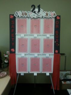 a display case with playing cards and numbers on the front for each player to play