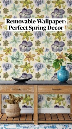 a wooden table with two vases on top of it next to a wall paper