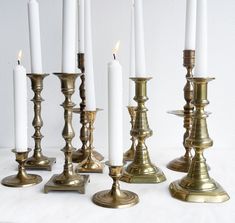 there are many candles that are lined up in the same row and one is white