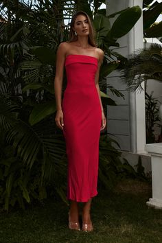 Featuring a classic slip style and a double folded strapless neckline, our Perez Long Midi Dress will be your go-to event dress. - Long midi length- Strapless neckline with gel tape- Double folded detail around neckline- Centre back invisible zipper- Lined without stretch- Fabric: 51% Viscose & 49% Rayon, Lining: 100% PolyesterPlease refer to care label for garment care instructions, Colours may appear slightly different to the website due to lighting, computer picture resolution and monitor settings. ~section~ Length: 113cm/44.5inches (Highest shoulder point to hem taken from size S). It is true to size. If you need more help with sizing, see our size guide or email us at sales@runawaythelabel.com ~section~ Mariah wears a size AU6 / XS / US 2 and is 178cm tall. Red Strapless Dress Outfit, Strapless Midi Dress Formal, Elegant Red Dresses, Midi Spring Dress, Strapless Dress Outfit, Red Maxi Dresses, Charro Dress, Strapless Red Dress, Bday Dress