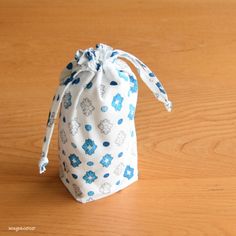 a small bag sitting on top of a wooden table