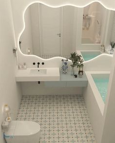 a bathroom with a sink, toilet and bathtub in the middle of it's walls