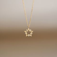 "JSVConcepts Fine Jewelry 14K Gold Star Pendant Necklace with Natural Diamonds / Constellation Star Charm Necklace / Star Pendant Necklace / Diamond Star Pendant ≫ Product Details ◈ Handmade / Handcrafted Fine Jewelry ◈ Pendant Size: approximately 11.70mm x 9.70mm ◈ Diamond: 100% Natural 'Conflict-Free' Diamond ◈ Diamond Carat Weight: .01 ct x 5 pieces = .05 ctw ◈ Diamond Color & Quality: G Color / VS-SI Clarity ◈ Cut: Brilliant Cut ◈ Metal: Solid 14k Gold (18k gold option available upon req Diamond Star Charm Pendant Necklace, Celestial Star Of David Necklace With Star Charm, Diamond Star Charm Necklace In Celestial Style, Gold Star Necklace With Diamond Accents, Gold Star Necklaces With Diamond Accents, Diamond Star Charm Necklace, Gold Star-shaped Necklace With Diamond Accents, Celestial Diamond Necklace With Star Charm, Celestial Diamond Star Charm Necklace