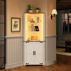 a white cabinet with lights on it in a living room