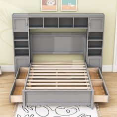 an image of a bed with drawers and headboard on the floor next to a rug