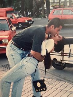 a man kissing a woman on the street