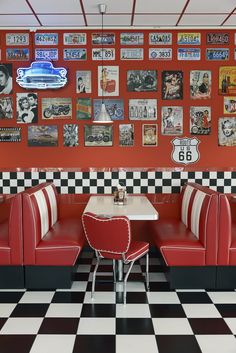 a checkered floor in a diner with red booths and black and white checkered walls