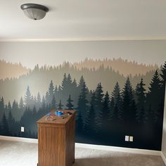 an empty room with a large mural on the wall and a wooden podium in front of it